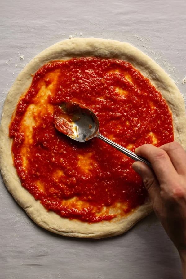 pizza sauce on the dough